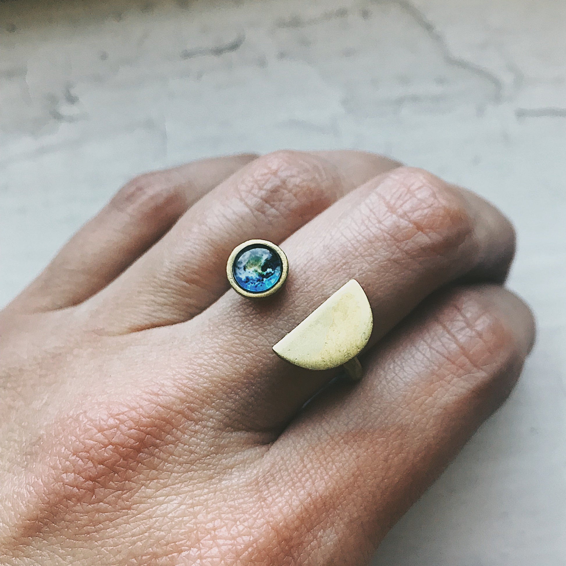 Earth Rise Ring inspired by the iconic view of Earth from space | Celestial ring with Earth gemstone for space lovers and dreamers | Planet Earth jewelry featuring a cosmic galaxy-style design | Unique galaxy ring capturing the magic of Earthrise from the Moon | Space-themed Earth ring with vibrant planetary detail and dark cosmic band | Astronomy-inspired jewelry perfect for stargazers and celestial dreamers | Cosmic statement ring symbolizing Earth's beauty and connection to the universe | Earth from spac
