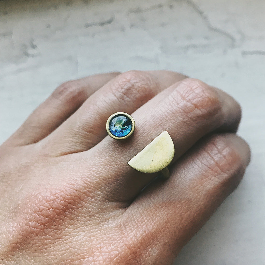 Earth Rise Ring inspired by the iconic view of Earth from space | Celestial ring with Earth gemstone for space lovers and dreamers | Planet Earth jewelry featuring a cosmic galaxy-style design | Unique galaxy ring capturing the magic of Earthrise from the Moon | Space-themed Earth ring with vibrant planetary detail and dark cosmic band | Astronomy-inspired jewelry perfect for stargazers and celestial dreamers | Cosmic statement ring symbolizing Earth's beauty and connection to the universe | Earth from spac