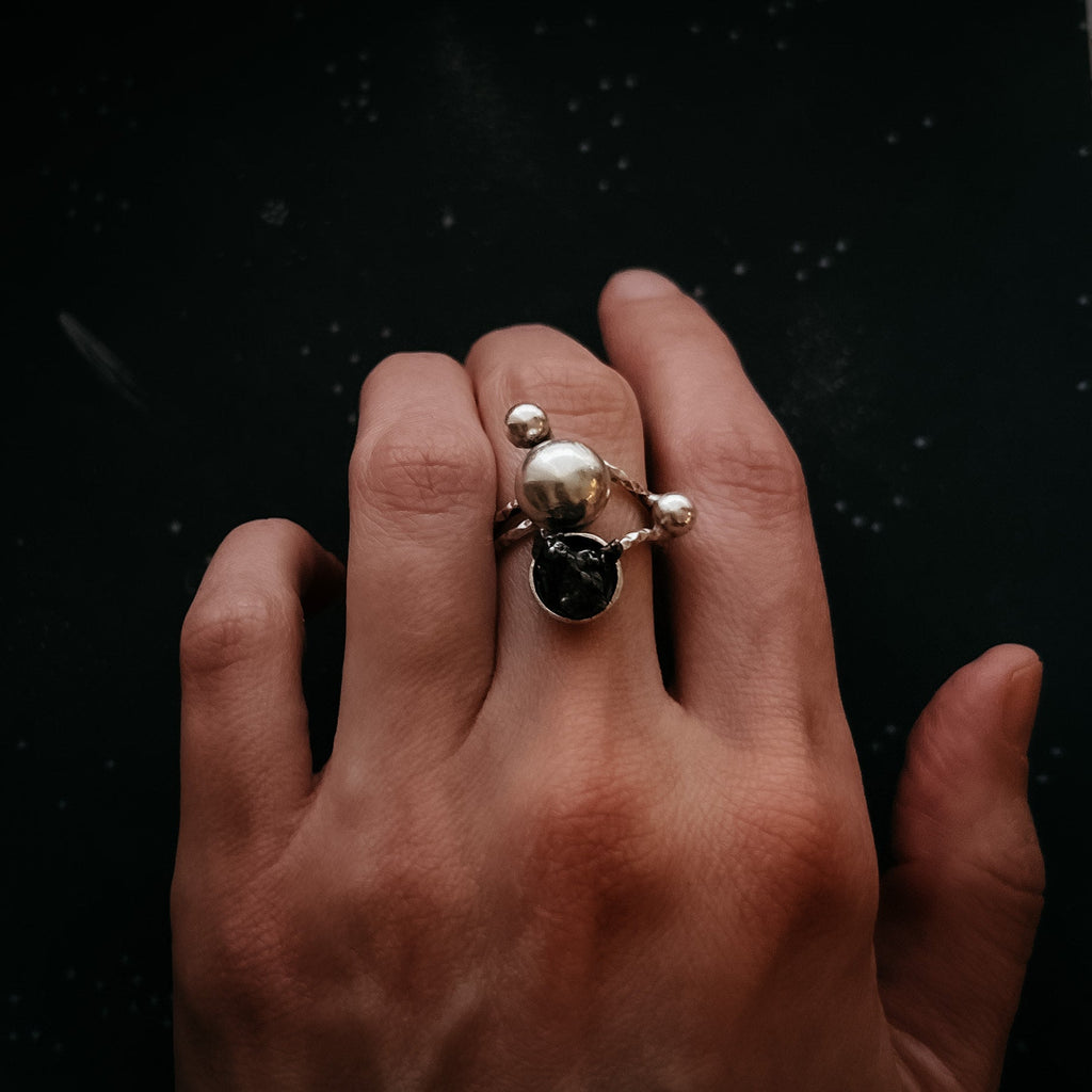 Celestial Orbital Style | CLEARANCE Cosmic Ring Crafted with Genuine Meteorite Fragment | Space Jewelry Ring with Orbit Motif and Authentic Meteorite | Unique Meteorite Ring for Astronomy and Science Enthusiasts | Celestial Orbit Ring with Real Meteorite from Outer Space | Statement Ring with Meteorite and Cosmic Motion Design | Orbiting Cosmic Bodies Ring with Rare Meteorite Stone | Meteorite Jewelry Gift for Space, Planet, and Star Lovers | Genuine Space Rock Ring in a Stylish Orbit-Inspired Setting