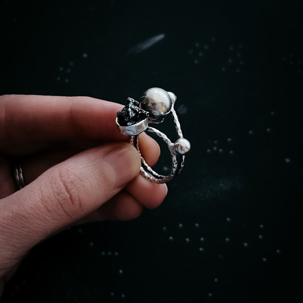Celestial Orbital Style | CLEARANCE Cosmic Ring Crafted with Genuine Meteorite Fragment | Space Jewelry Ring with Orbit Motif and Authentic Meteorite | Unique Meteorite Ring for Astronomy and Science Enthusiasts | Celestial Orbit Ring with Real Meteorite from Outer Space | Statement Ring with Meteorite and Cosmic Motion Design | Orbiting Cosmic Bodies Ring with Rare Meteorite Stone | Meteorite Jewelry Gift for Space, Planet, and Star Lovers | Genuine Space Rock Ring in a Stylish Orbit-Inspired Setting