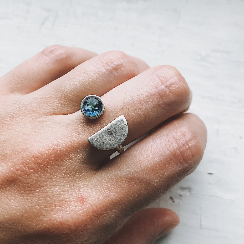 Earth Rise Ring inspired by the iconic view of Earth from space | Celestial ring with Earth gemstone for space lovers and dreamers | Planet Earth jewelry featuring a cosmic galaxy-style design | Unique galaxy ring capturing the magic of Earthrise from the Moon | Space-themed Earth ring with vibrant planetary detail and dark cosmic band | Astronomy-inspired jewelry perfect for stargazers and celestial dreamers | Cosmic statement ring symbolizing Earth's beauty and connection to the universe | Earth from spac